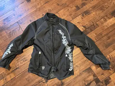 I'm selling a stylish ladies motorcycle jacket, perfect for any rider. The jacket is a women's size...