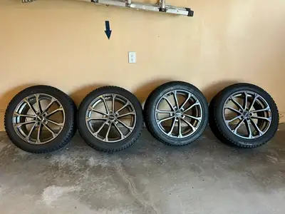 Set of Bridgestone winter tires on alloy rims in perfect condition. No TPMS sensors. Tires used on V...