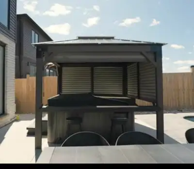 9'x9' crafted from SPF lumber, metal corner brackets and featuring a durable dark bronze metal roof...