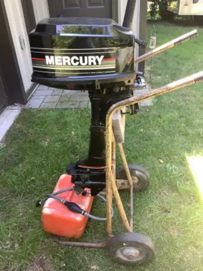 Mid nineties 2 stroke short shaft outboard motor with tank and new fuel line. Excellent running cond...