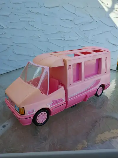 The Vintage Mattel Barbie Magical Motorhome RV is a charming pink camper vehicle. The 24-inch long a...