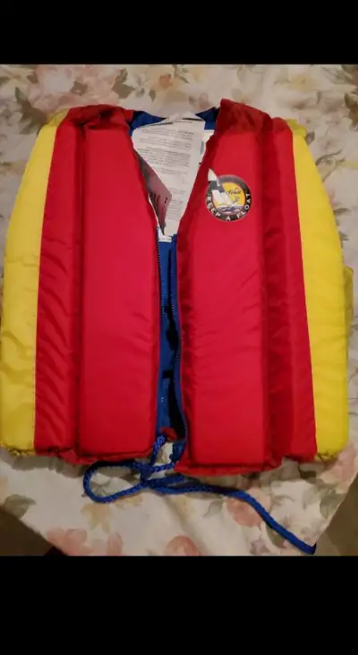 Branded Keep A Float yellow and red swimming life vest for kids. Comes in with form and Zipper closu...