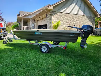 12" John Boat, like New. Still have the stickers, pedals, fishifinder, safety box, etc..8Hp Yamaha e...