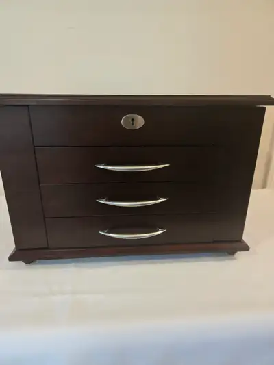 Lovely Jewelry Chest. 3 drawer with mirror, 2 side necklace holder compartment. Height 12", width 10...