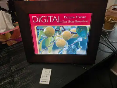 Digital picture frame. Solid wood frame. Remote control. Plays videos, music and photos. Great for t...