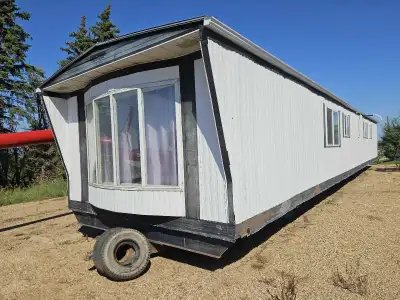 Had a plan for it but plans changed. Newer cabinets and flooring in main area, new door. On wheels....