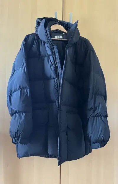 Up for sale Uniqlo U warm padded puffer coat. Black colour. Size L, fits like XL. Excellent conditio...