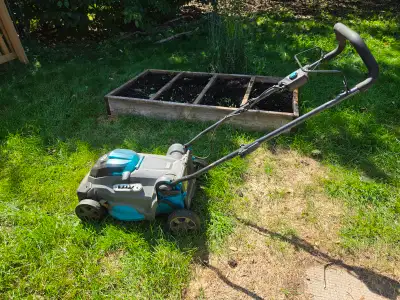 Yardworks electric lawnmower, two batteries and charger, View more