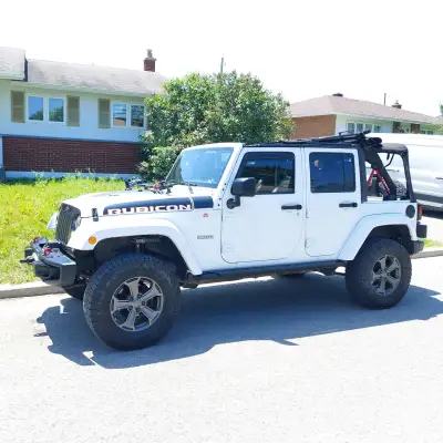 Very clean, hard and soft top. New adjustable falcon shocks , clear, vinyl wrap, front winch, traile...