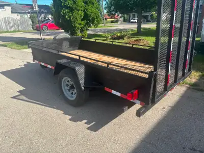 Landscape trailer 5’x10’ , folding down ramp, 2x6 pressure treated floor, tires installed 6 months a...