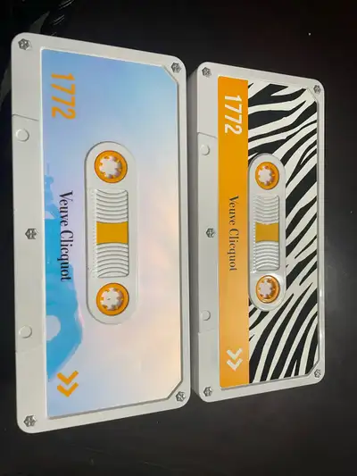 Add a touch of bubbly elegance to your collection with these two Veuve Clicquot cassette cases! They...