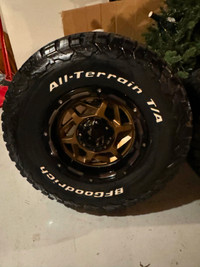 4 A-T bf Goodrich 17in tires,with 17 grid off rd multi stud rims
