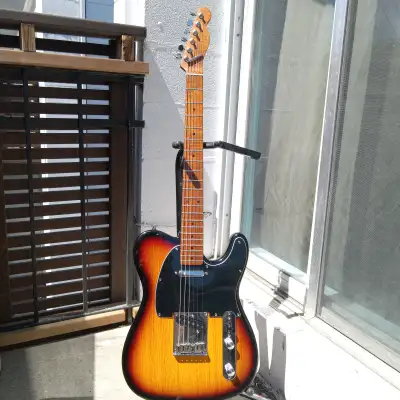 Allparts Telecaster ® 1-Piece Alder body finished in 3-tone Sunburst under hard polyurethane. Canadi...