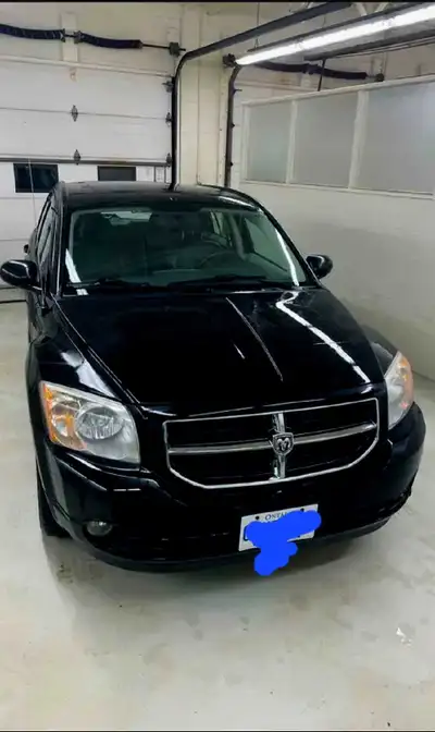 2009 Dodge Caliber. 160K kilometers. Very Low. 2.0L A/C. Cruise Control. Fog Lights. Tilt Steering....