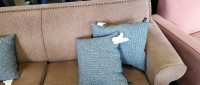 FABRIC COUCH WITH STUD ACCENTS AND THROW PILLOWS -