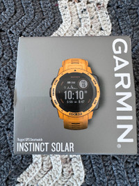 Montre Garmin Instinct Solar / bracelet jaune / très peu portée