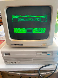 Vintage Tandy computer 1000 SL/2. Turns on displays as shown.
