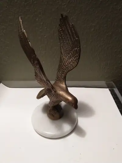 Vintage brass eagle on marble base., View more
