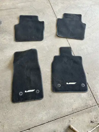 These are a set of used OEM black floor mats from a Cadillac CT5-V. They are in good condition, but...