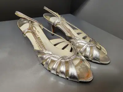 I bought these beautiful silver high-heeled sandals at a Norman Kaplan boutique in one of the Casino...