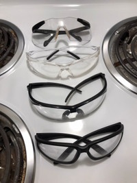 4 PAIRS OF SAFETY GLASSES ( 2 are SMITH & WESSON ) . 