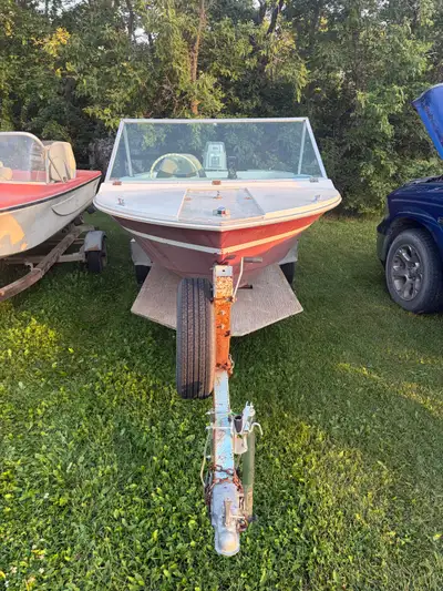 Grew SS140 fiberglass boat with 55 HP Evinrude outboard, Garmin fishfinder/GPS and trailer. Motor ru...