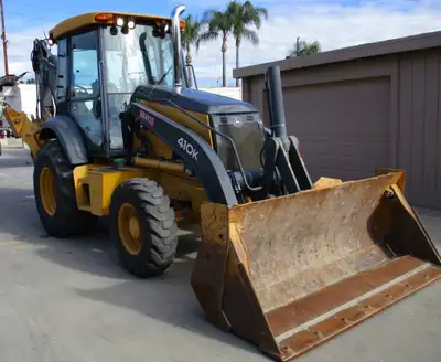 ISO used John Deere 410K or 410L backhoe. Must have quick change front loader with 4 in 1 bucket, an...