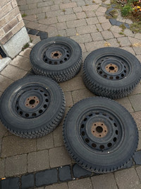 Snow tires on rims for a Nissan rogue