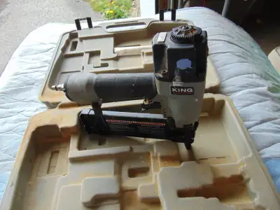 King nail gun takes nails up to 2 in works was being used has some paint splashes on it has case CAL...