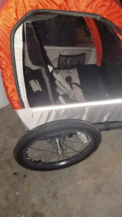 Bike trailer for pulling 2 kids. Pretty much brand new, used twice.