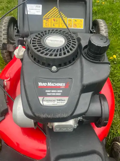 I am selling a Yard Machines lawn mower with a 140cc engine, front wheel drive, and a 21-inch cuttin...