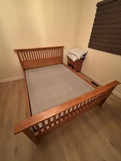 This is a sturdy, used IKEA queen bed frame with box spring. Bed will be disassembled for pickup. He...