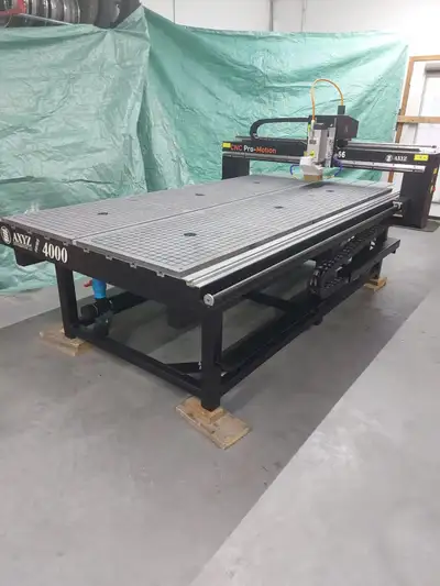 axyz 4000 series table retrofited by cnc pro-motion. Brand new splindle, step motor and all electric...
