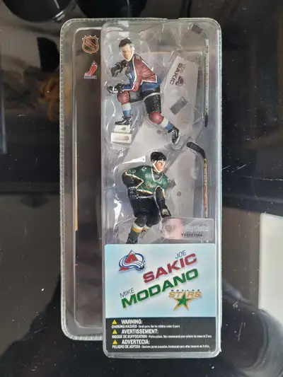 Up for grabs are these NHL collectible figures featuring Mike Modano and Joe Sakic, still sealed in...