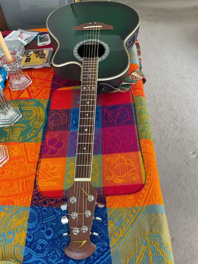 Ovation Acoustic Guitar, Celebrity, CS 148, made in Korea. Lists on eBay for $1,000