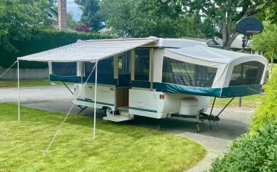 This isn’t your average tent trailer; it’s a 1997 Fleetwood Coleman, known for its quality, durabili...