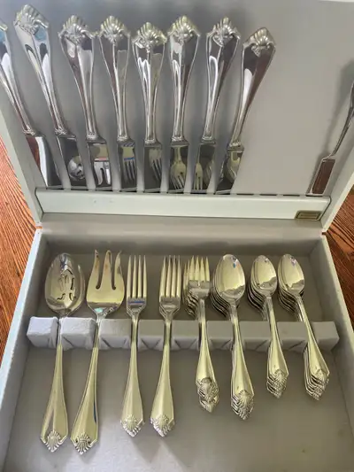 This is a Oneida "King James" silver plated flatware set, including 8 place settings and 4 serving p...