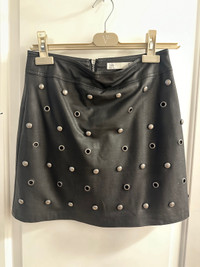 Black skirt fake leather material.