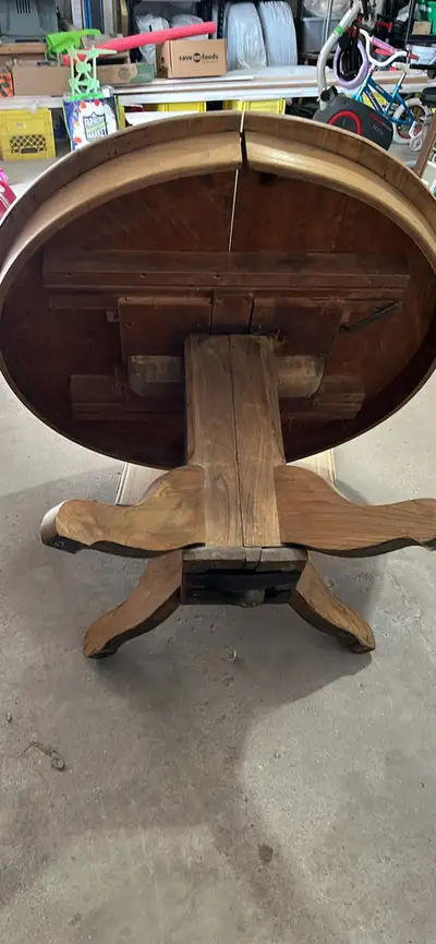 Solid 44” round wooden antique table which has been stripped and ready to be sanded and stained or c...