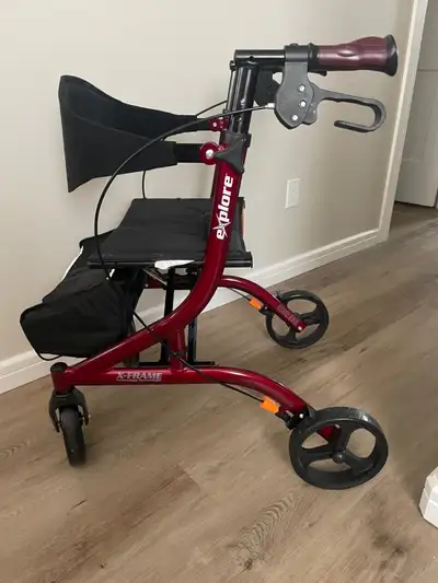 A HUGO mobility walker. Model # 700-981. Fold up style. Light weight. Extra grip hand grips. Never u...