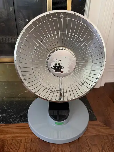 This is a MACH electric heating fan, perfect for providing warmth during the colder months.