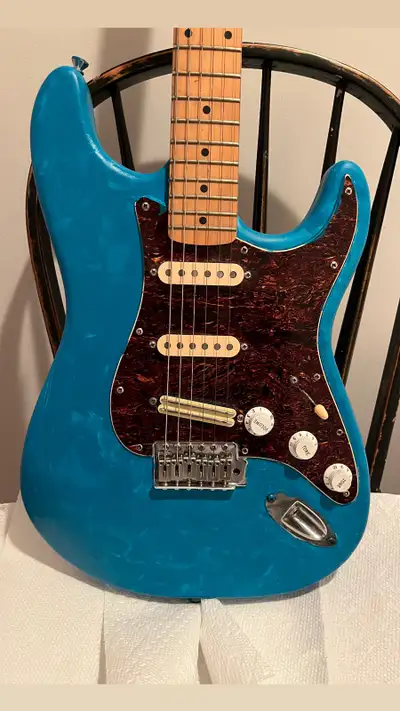 Squier Strat with Mexican pickups, stacked bridge pickup. I painted it turquoise, original colour is...