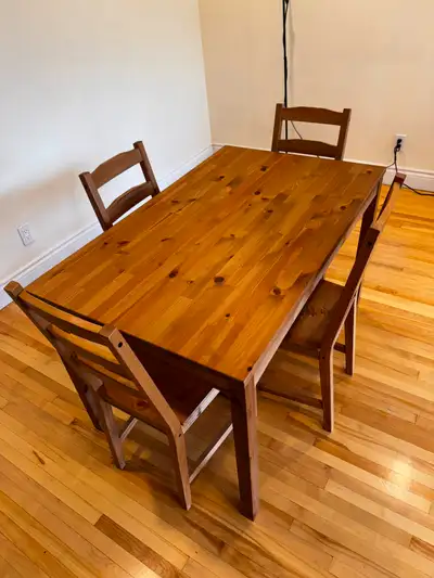 Used IKEA HÄGERNÄS dining table and four chairs in solid pine, originally purchased for 265 CAD (tax...
