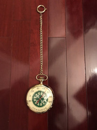 Vintage thermometer in a shape of golden pocket watch.21”x5,5