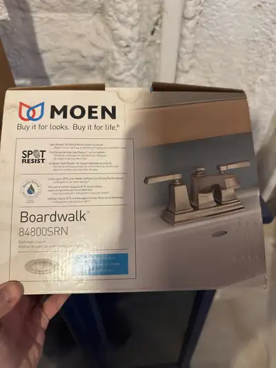This is a new Moen Boardwalk 84800SRN bathroom faucet that features a Spot Resist brushed nickel fin...