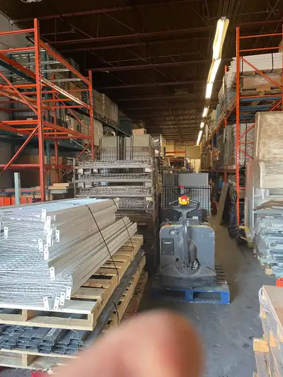 Large variety of Used warehouse equipment, including: Used shelving ( Industrial and retail store)....