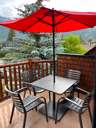 Aluminum patio set with 4 chairs, table and umbrella. Slight stains on tabletop, priced accordingly....