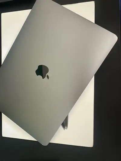 Used MacBook Pro. Has a sleek space gray finish. Keyboard layout is French (AZERTY). No cracks on th...