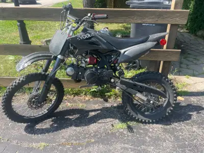 Evoque 125cc dirt bike, runs great. New handlebar grips and a new air filter. Aggressive knobby tire...