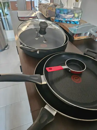 3 FRY PANS & A 2 HANDLE SAUTE PAN WITH LID, View more